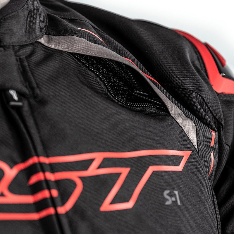       With its futuristic style, the S-1 textile jacket is a bold and vibrant take on protective motorcycling apparel, built to perform.  Made from robust MaxTex fabric, the jacket also features fixed mesh and SinAqua waterproof linings, a removable thermal lining and multiple intake and exhaust vents to protect you from all the elements.  Added to this are the motion panels on the back of the elbow and arm, along with cuff, sleeve and waist adjusters which offer a tailored fit.  Rated CE Level