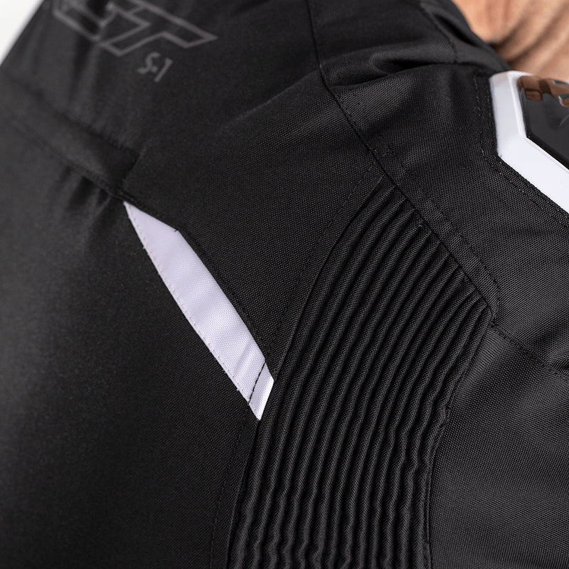        With its futuristic style, the S-1 textile jacket is a bold and vibrant take on protective motorcycling apparel, built to perform.  Made from robust MaxTex fabric, the jacket also features fixed mesh and SinAqua waterproof linings, a removable thermal lining and multiple intake and exhaust vents to protect you from all the elements.  Added to this are the motion panels on the back of the elbow and arm, along with cuff, sleeve and waist adjusters which offer a tailored fit.  Rated CE Level